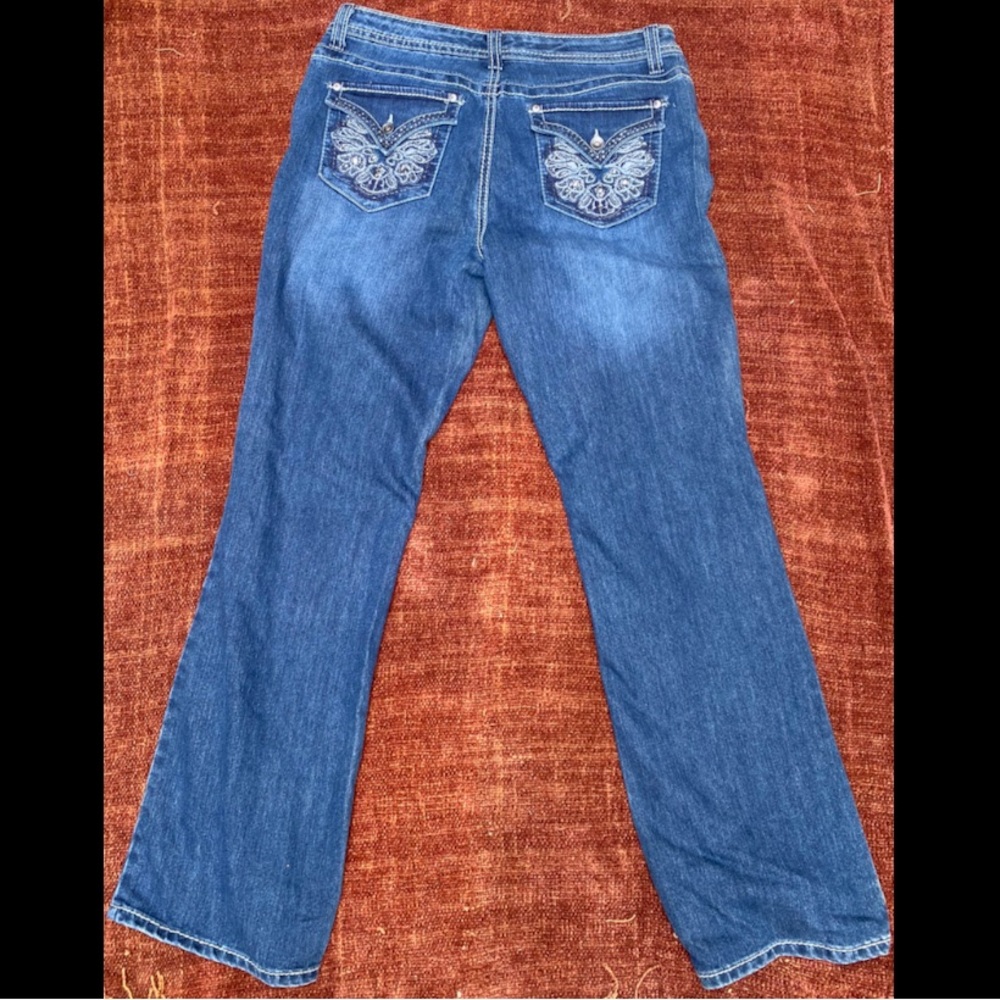Blue jeans by Nine West with embroidered rhinestone back pockets.
